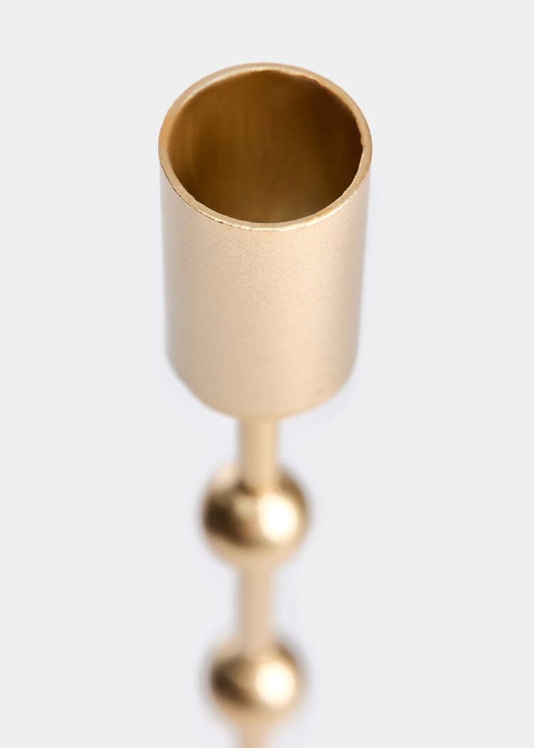 Высокий металлический подсвечник 
